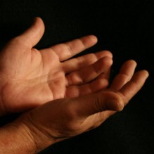 Giving Hands and Red Pushpin